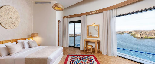 Suite bedroom with panoramic water views