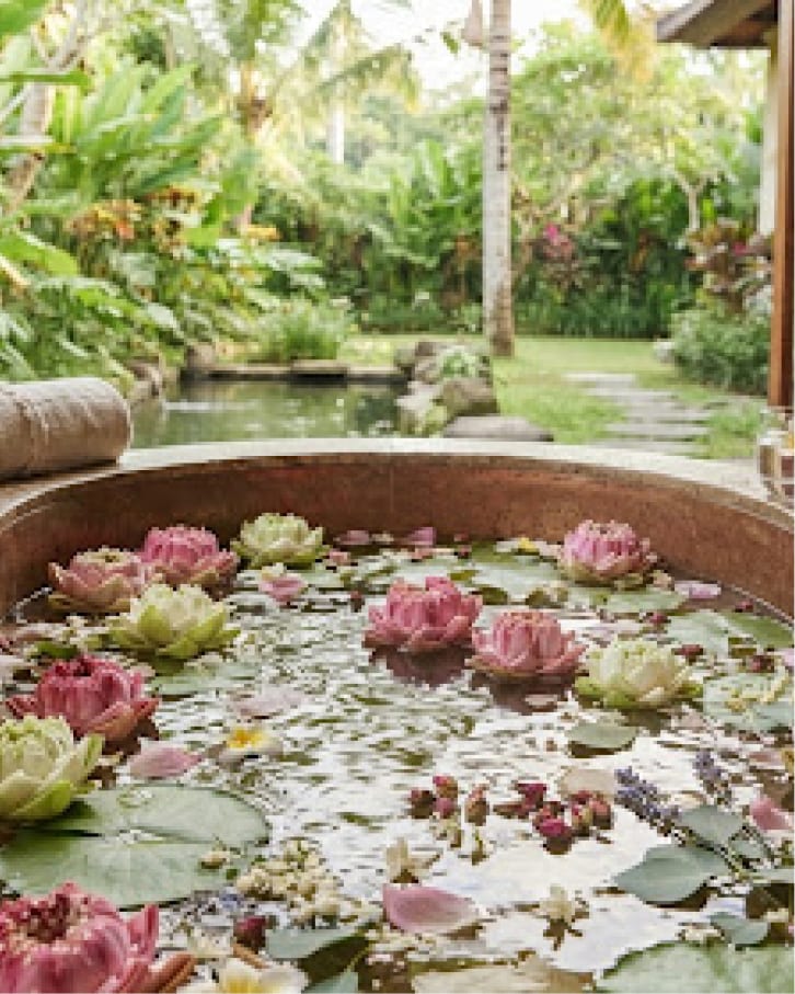 Outdoor wooden tub filled with lotus flowers