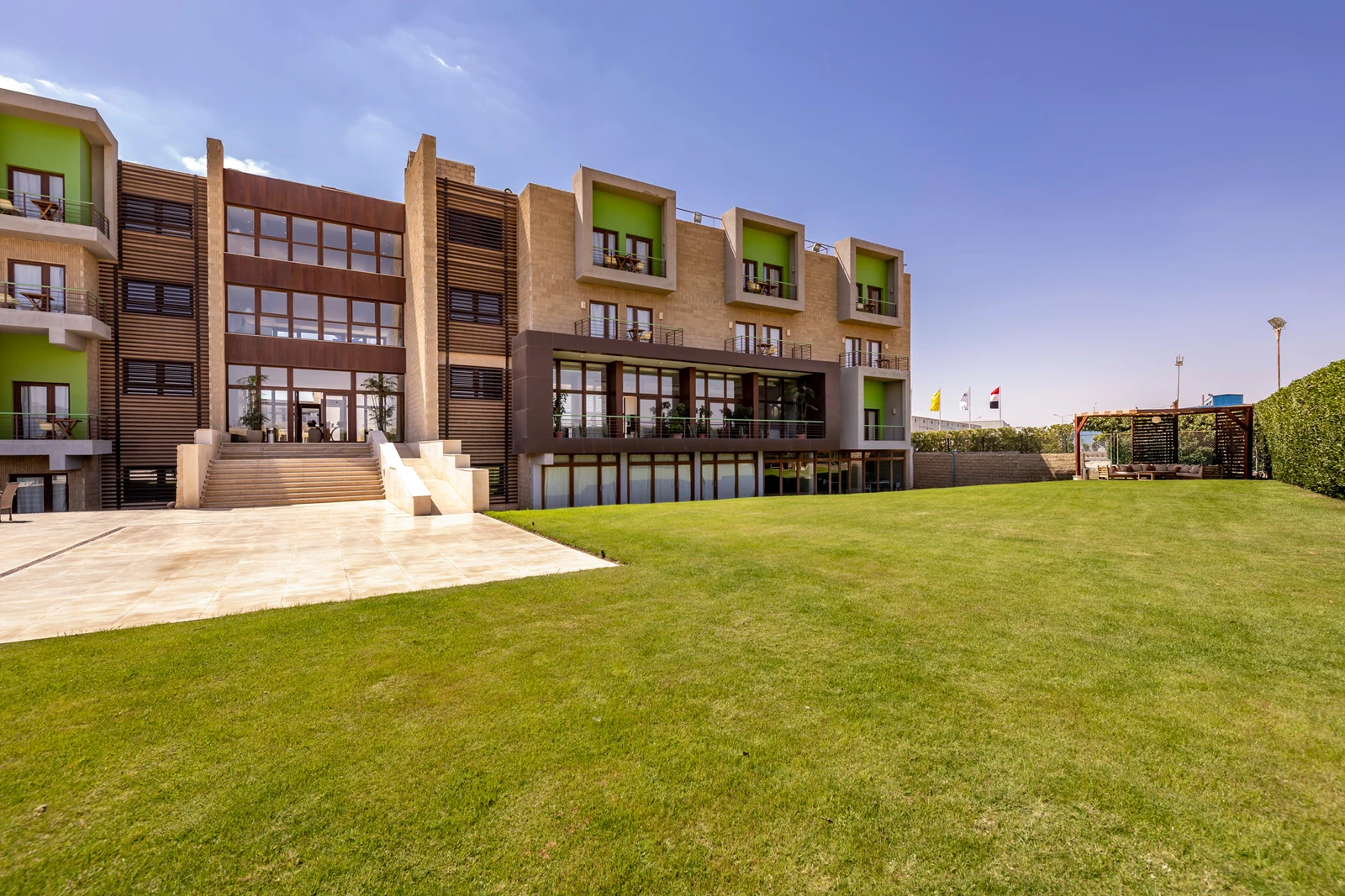 Outdoor lawn and hotel facade for wedding receptions