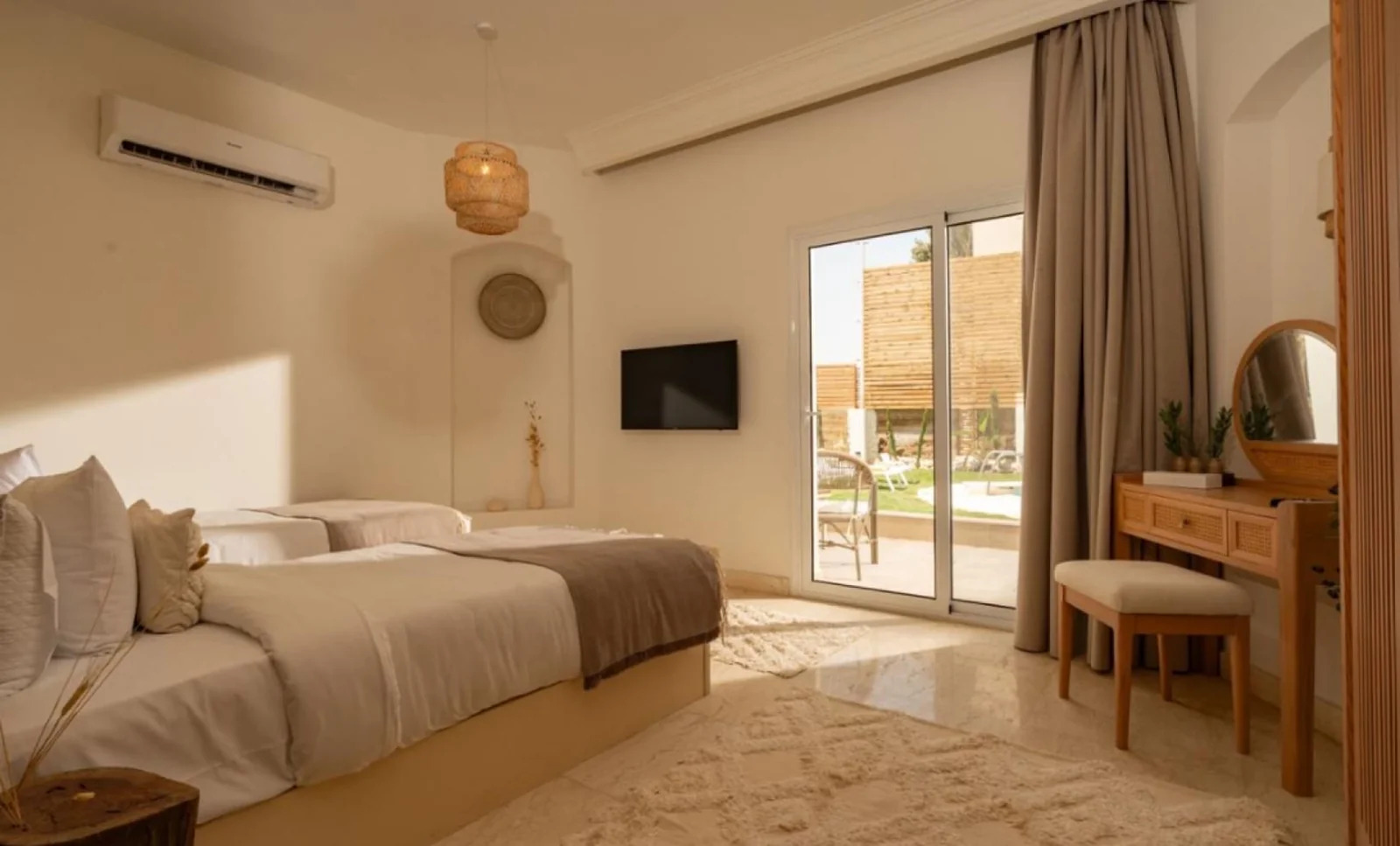Bright suite bedroom with patio access